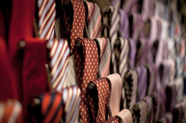 a rack of patterned ties